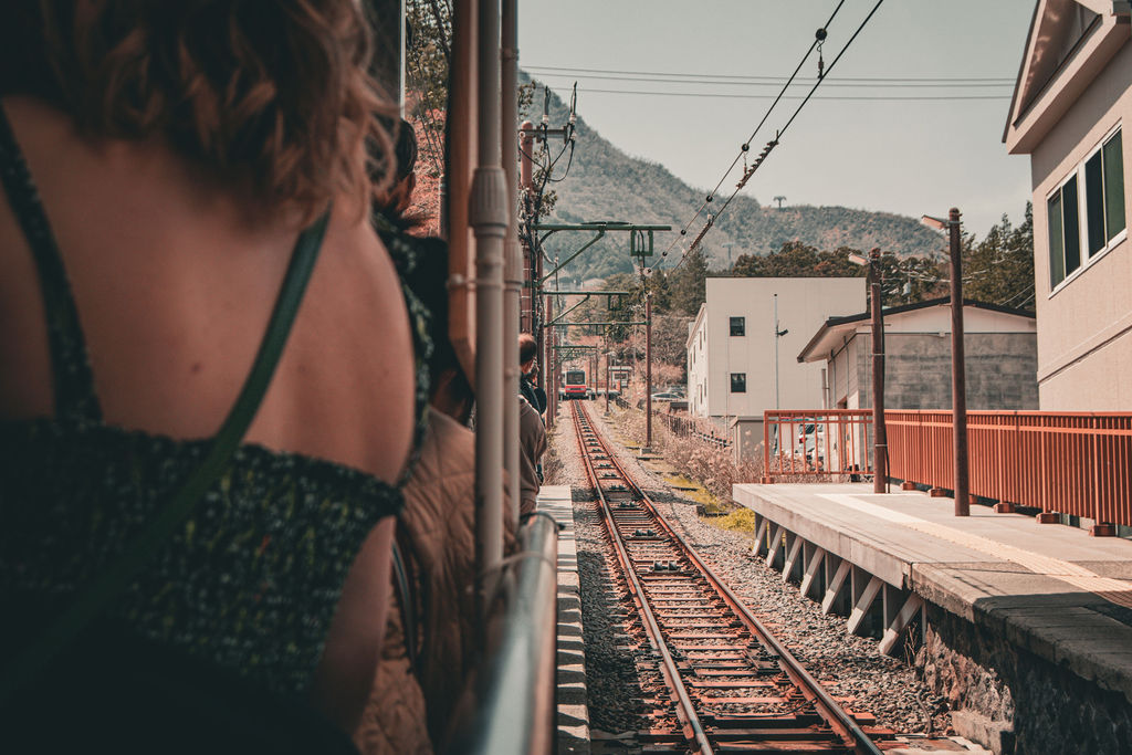 Looking out of a train window at a mountain station in Hakone