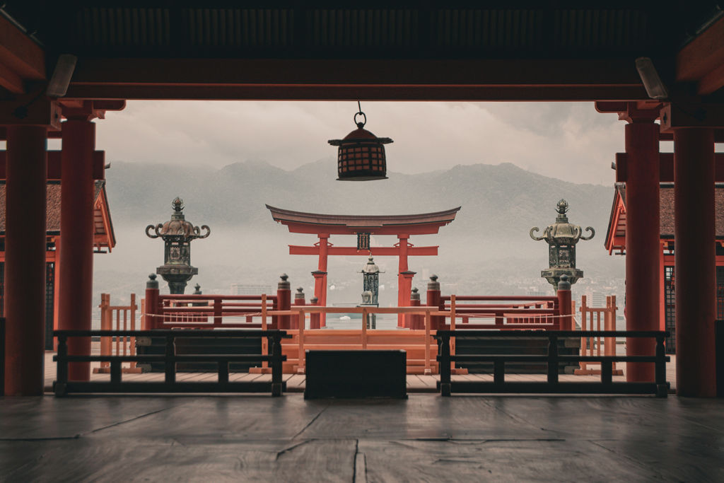 The floating torii of Itsukushima Shrine, framed by the red shrine hall, Miyajima