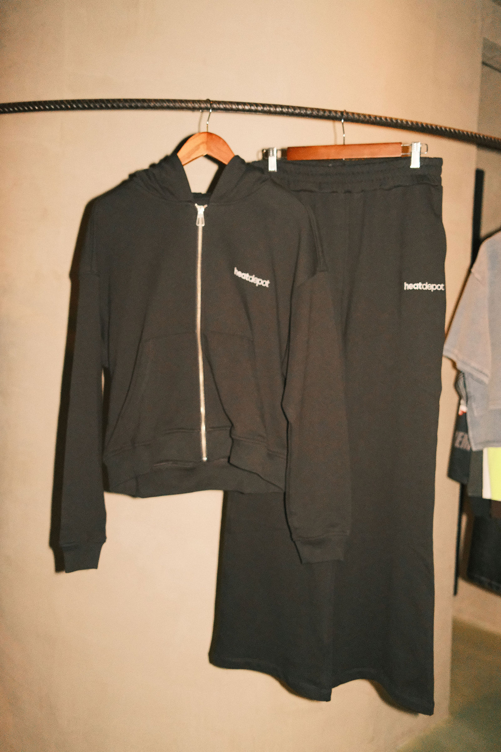Black Heat Depot apparel set displayed on a store rack