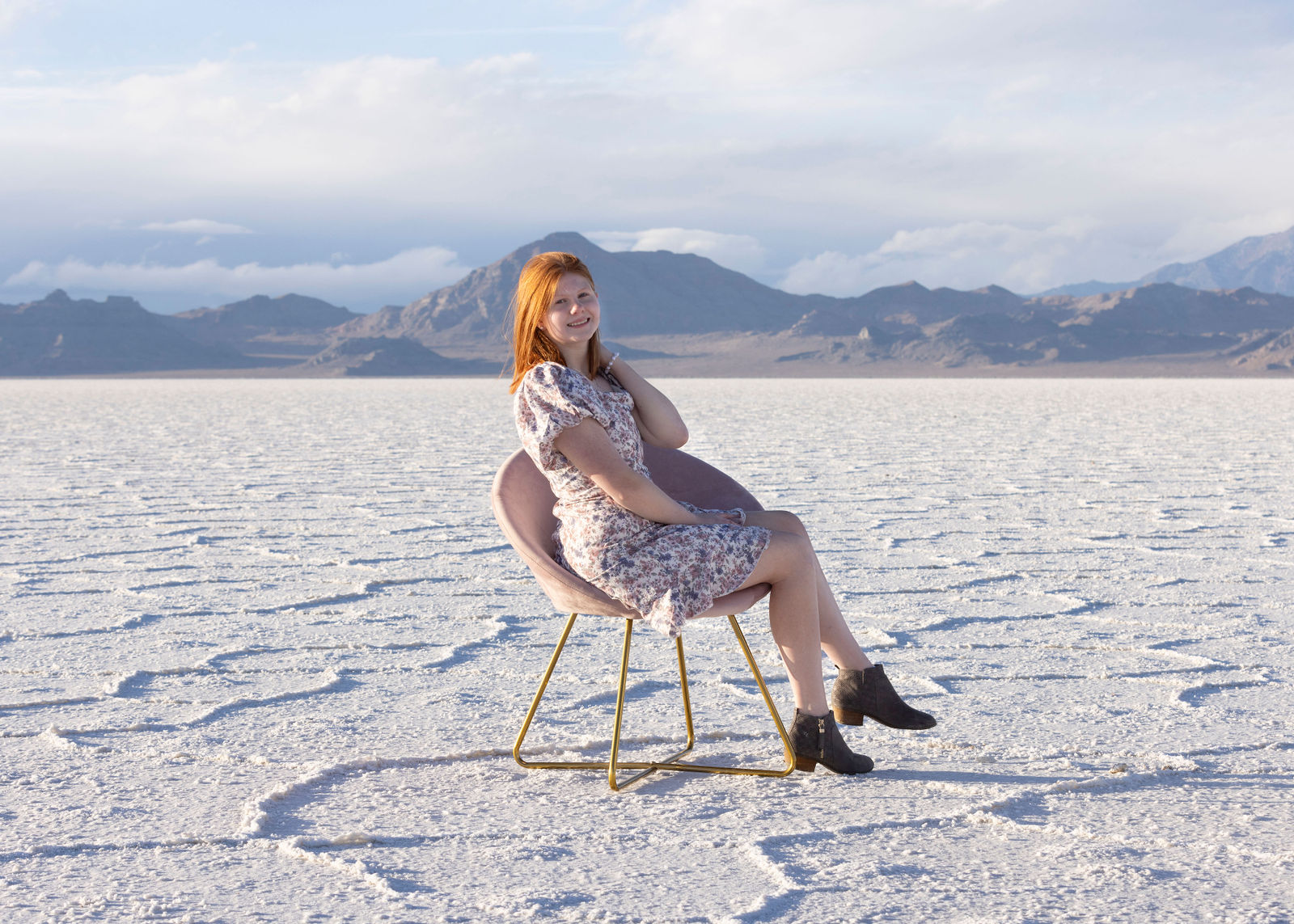 Drone aerial senior photo at Bonneville Salt Flats showing dramatic scale
