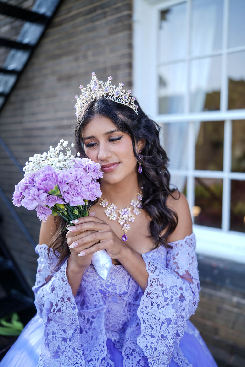 Quinceañera in elegant ball gown — full-length portrait