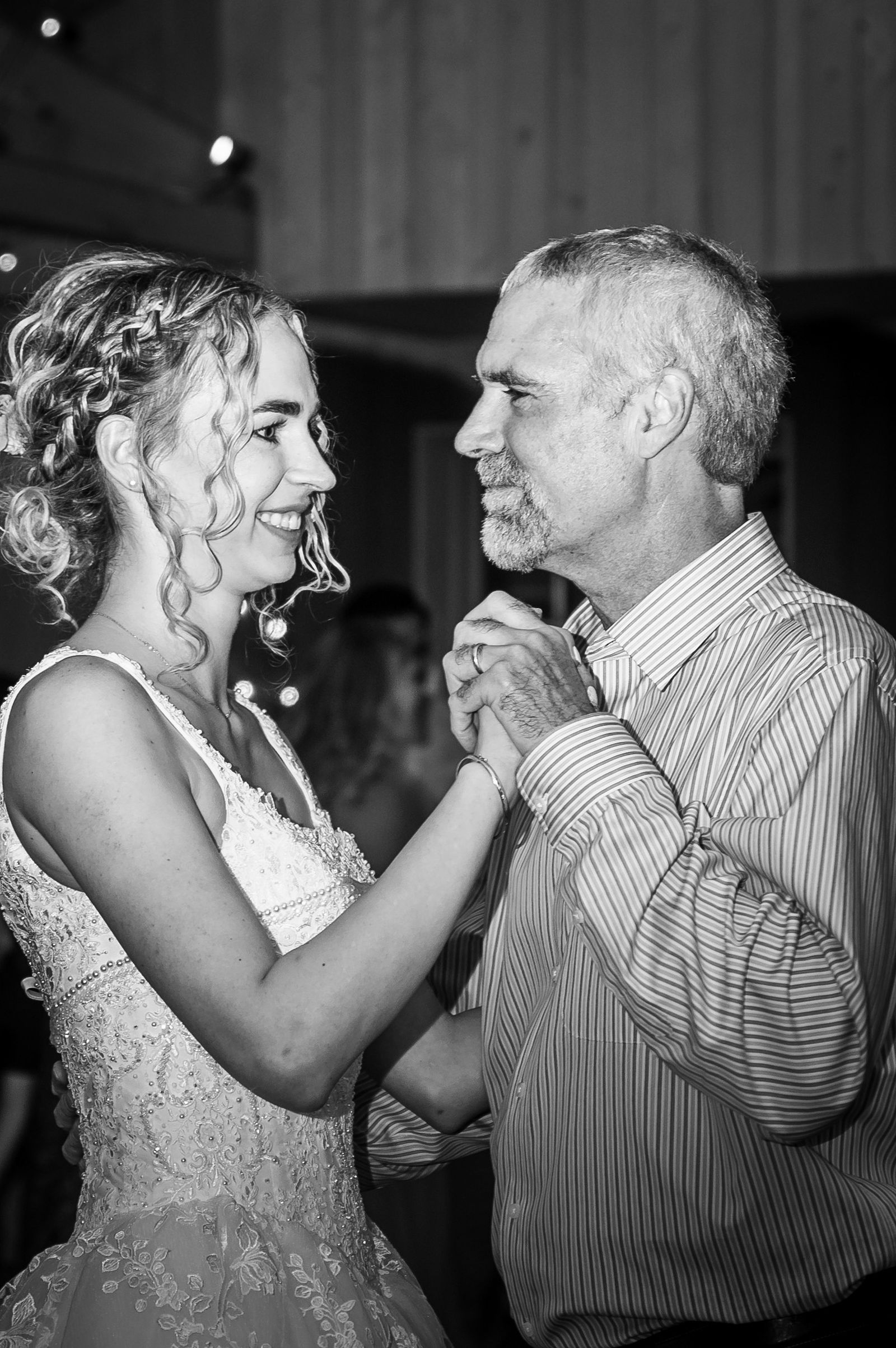 Black and white first dance at the reception at The Barn at Raccoon Creek in Littleton, Colorado