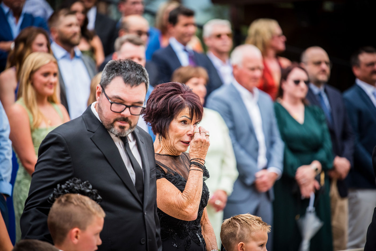Guests wiping away tears during the ceremony at Della Terra Mountain Chateau in Estes Park, Colorado