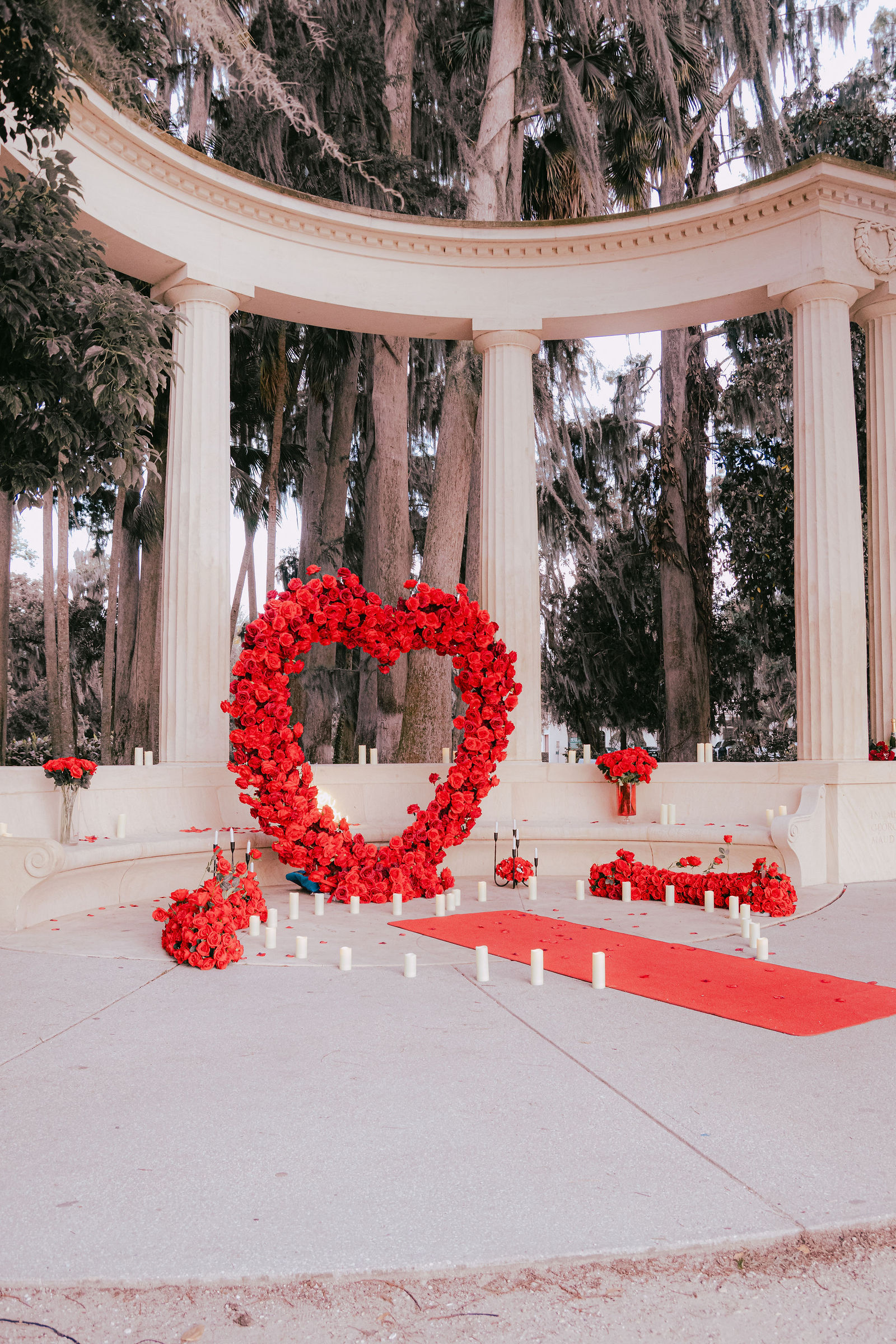 Romantic proposal setup with candles and flowers