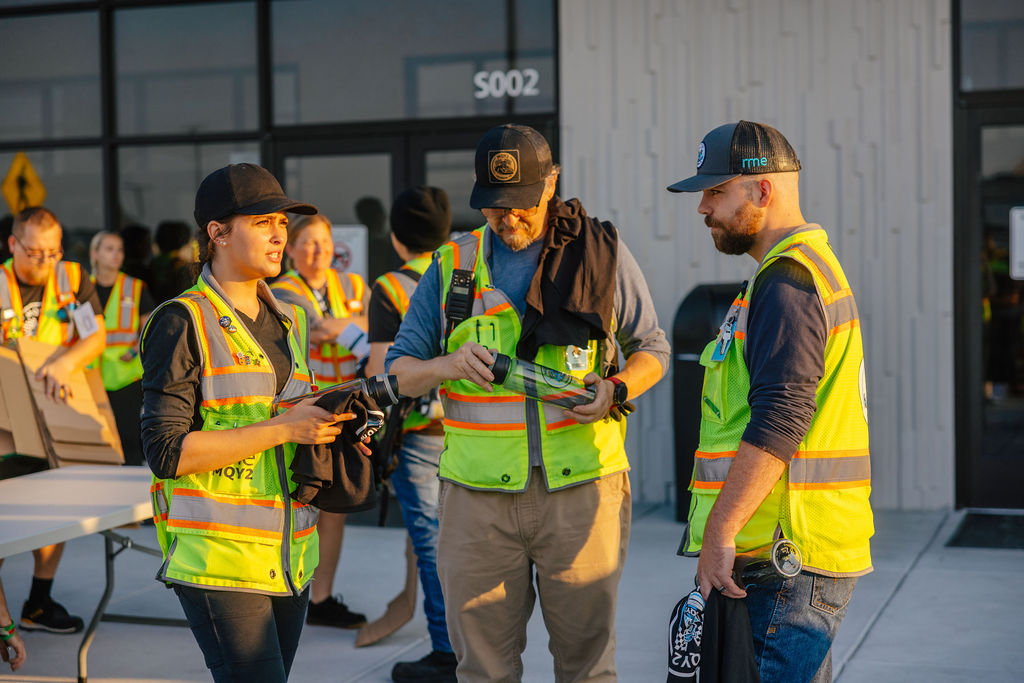 Candid golden-hour photo of event staff, an example of an event photography company's candid coverage
