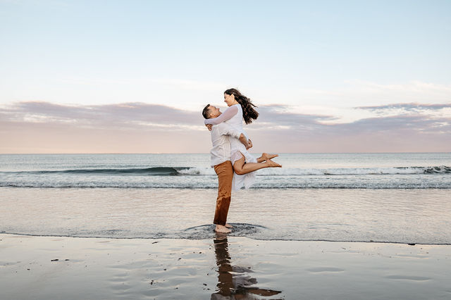 Bride and groom pose together after their ceremony