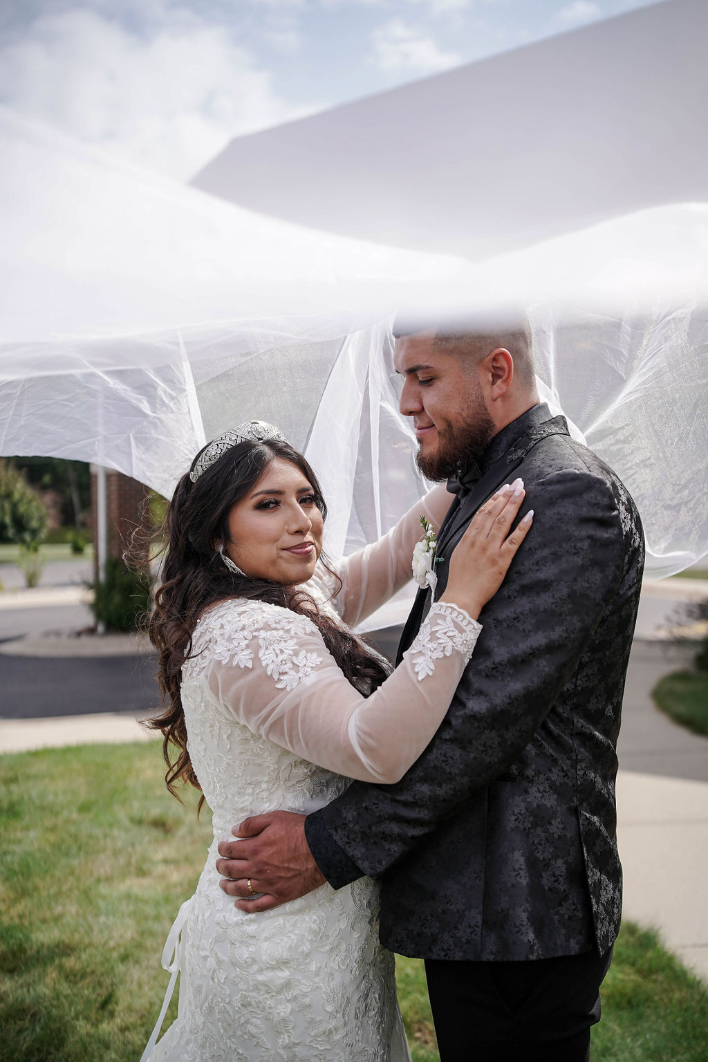 Jose and Melonie holding each other close