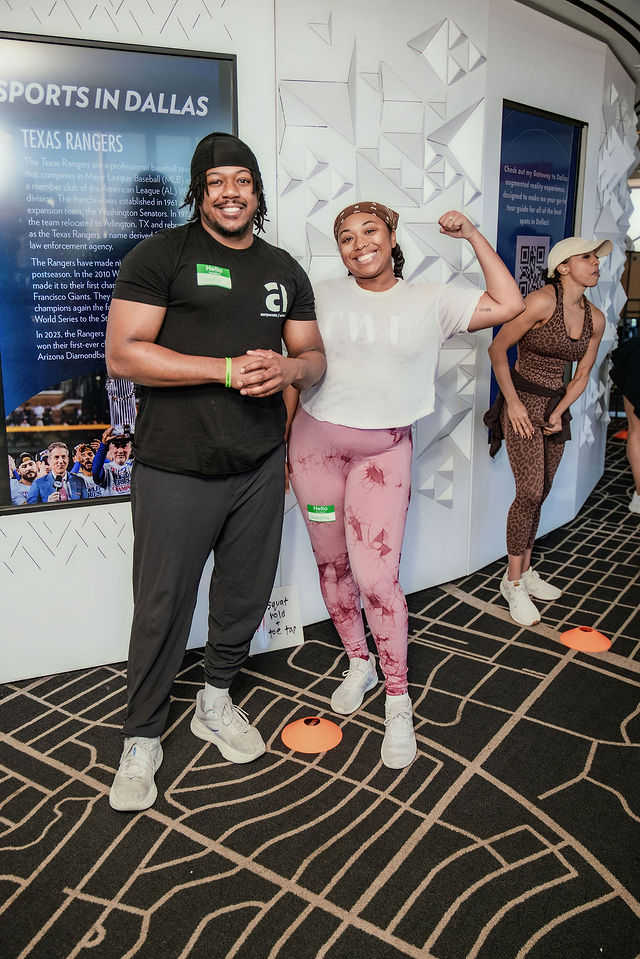 Two Corporate Athlete attendees smiling together at Reunion Tower