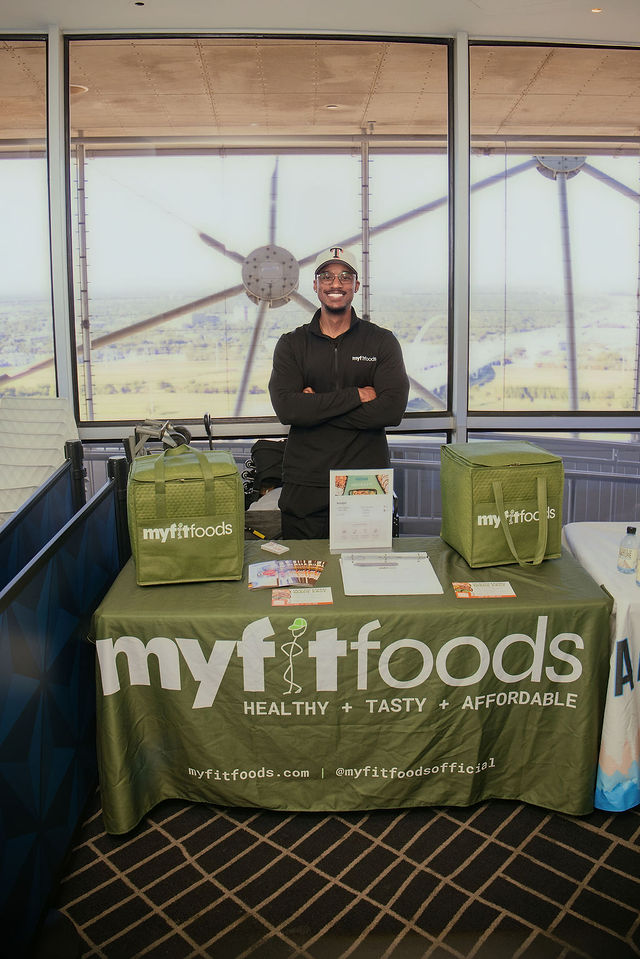 A smiling My Fit Foods partner at Bigger in Texas