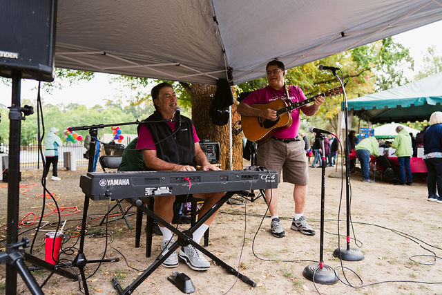 Musicians performing under a tent