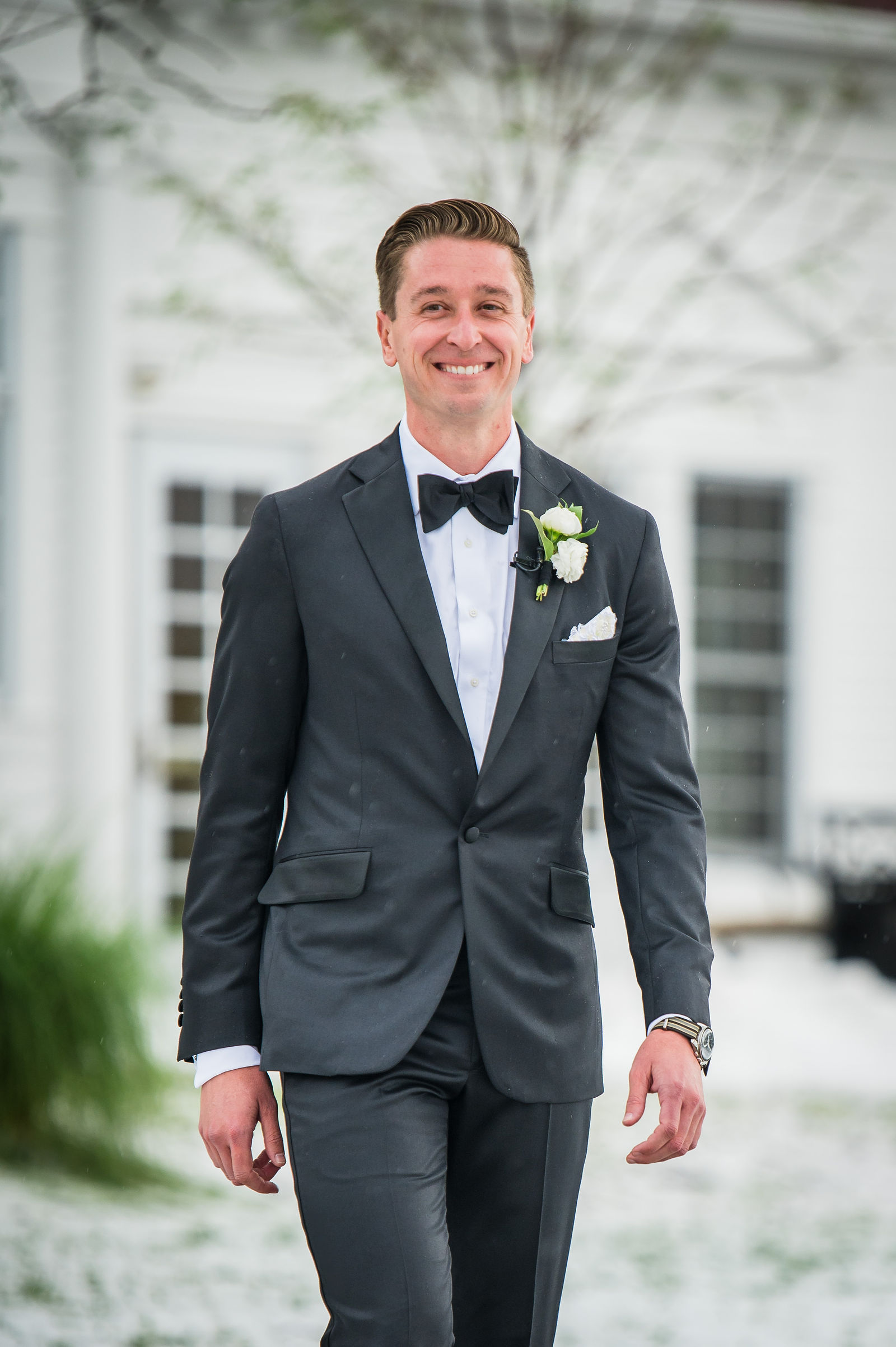 Groom walking down the aisle at The Manor House in Littleton, Colorado
