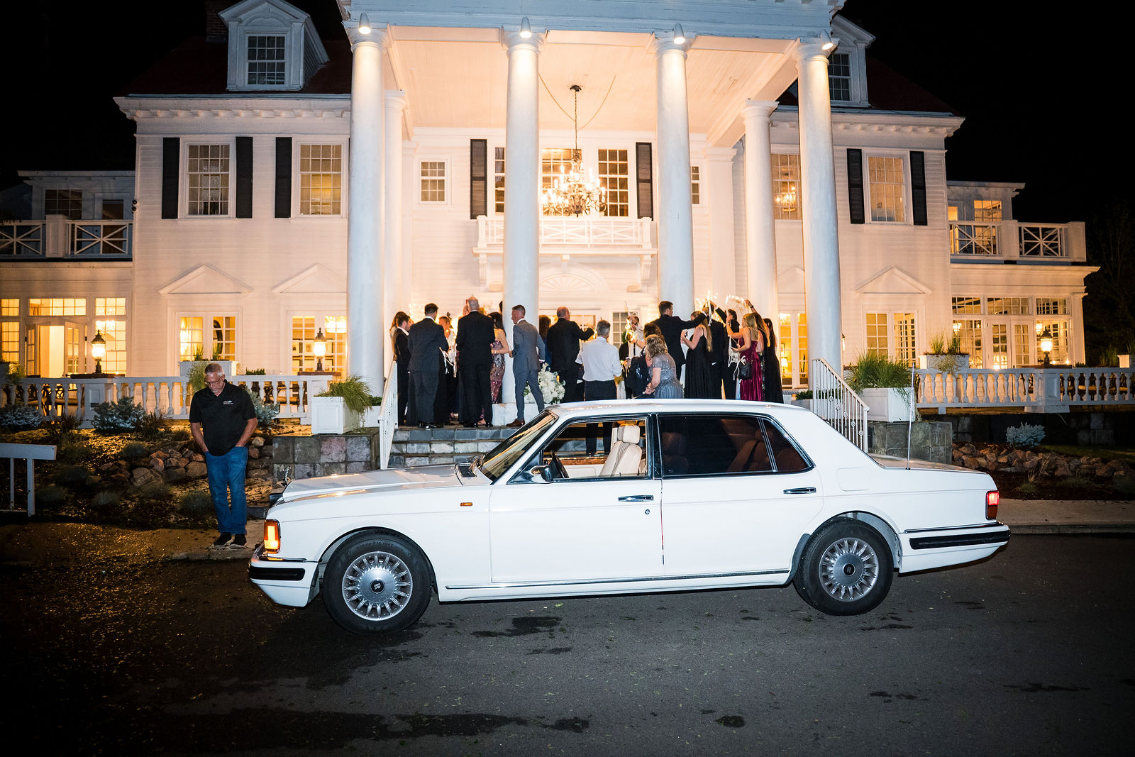 Vintage car outside The Manor House at night