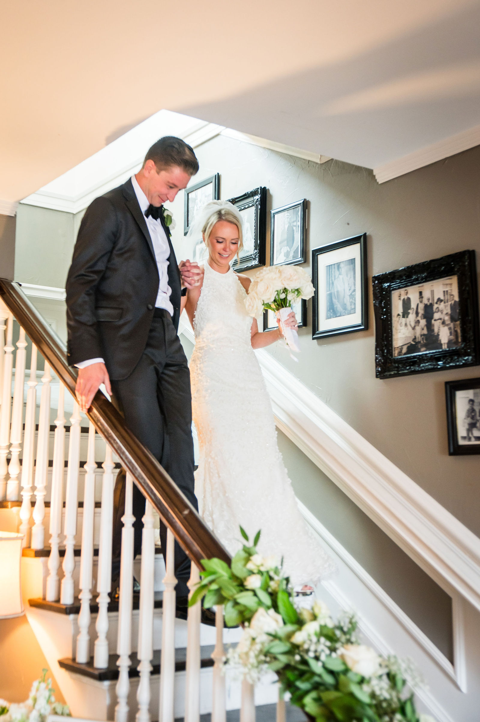 Bride and groom on the staircase at The Manor House in Littleton, Colorado