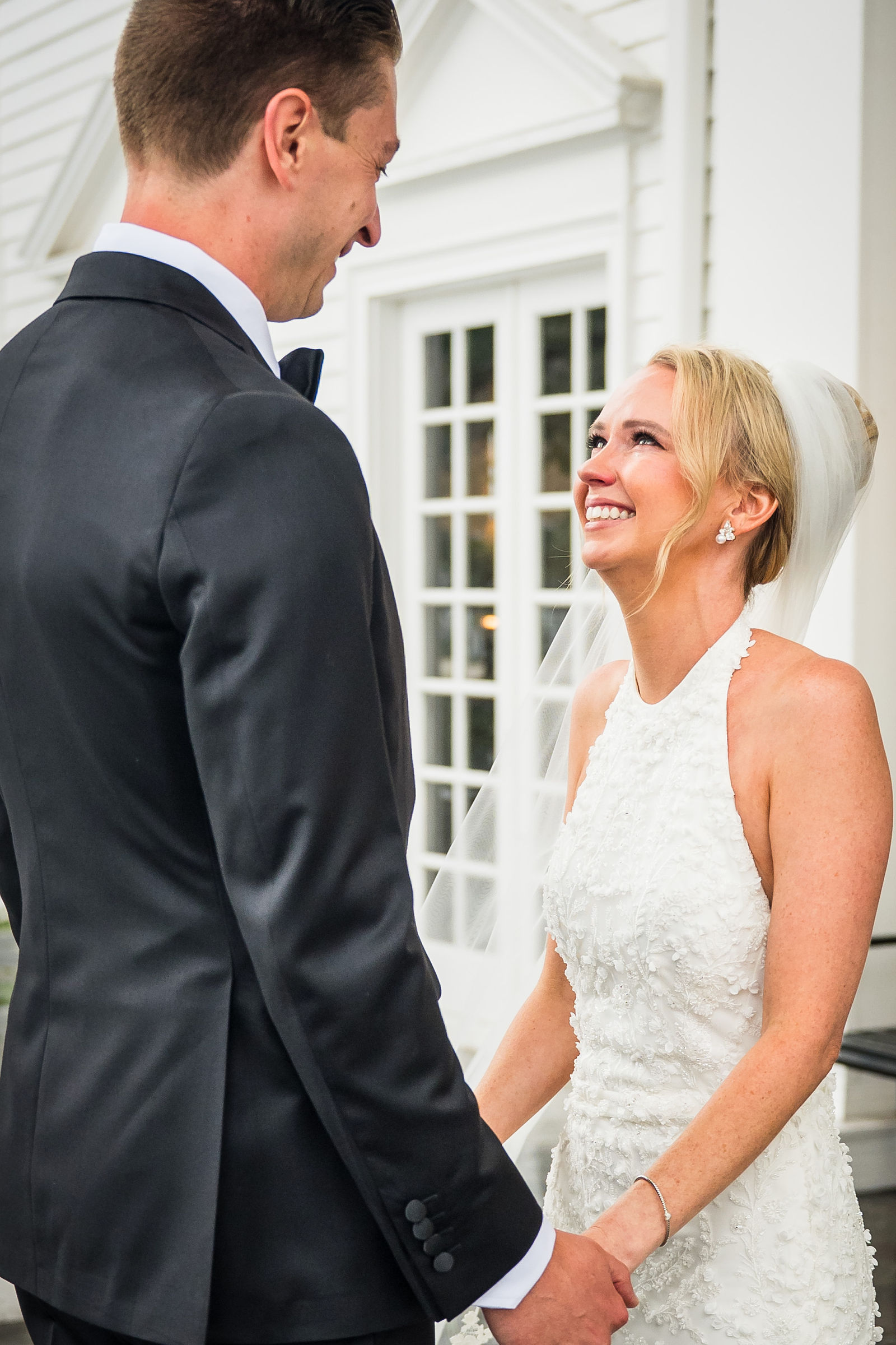 Bride and groom laughing during private vows at a Manor House wedding