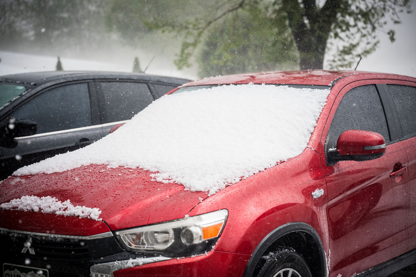 August hail on a car at The Manor House in Littleton