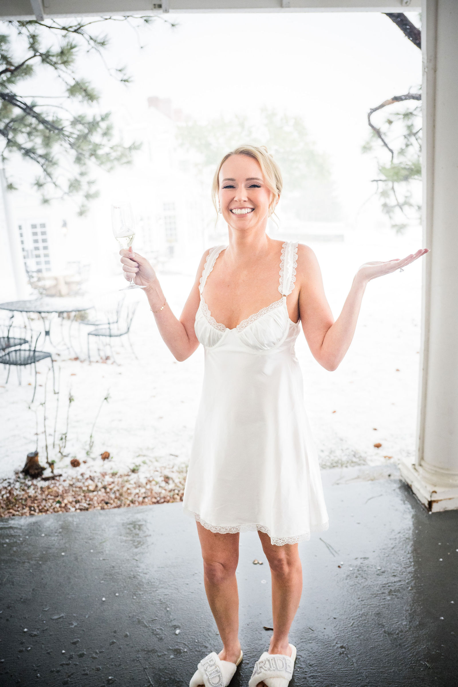 Bride on the lawn during an August hailstorm at The Manor House in Littleton, Colorado