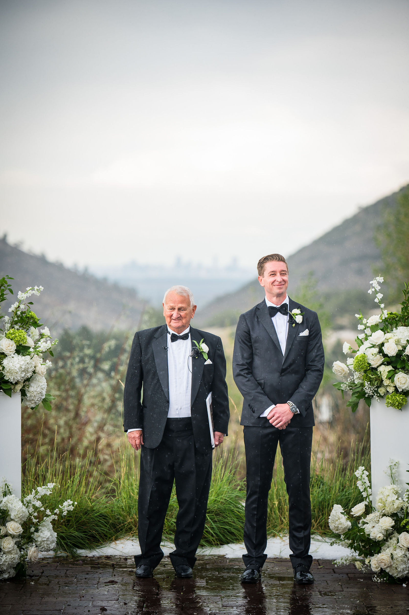 Bride walking down the aisle with her father at The Manor House in Littleton, Colorado