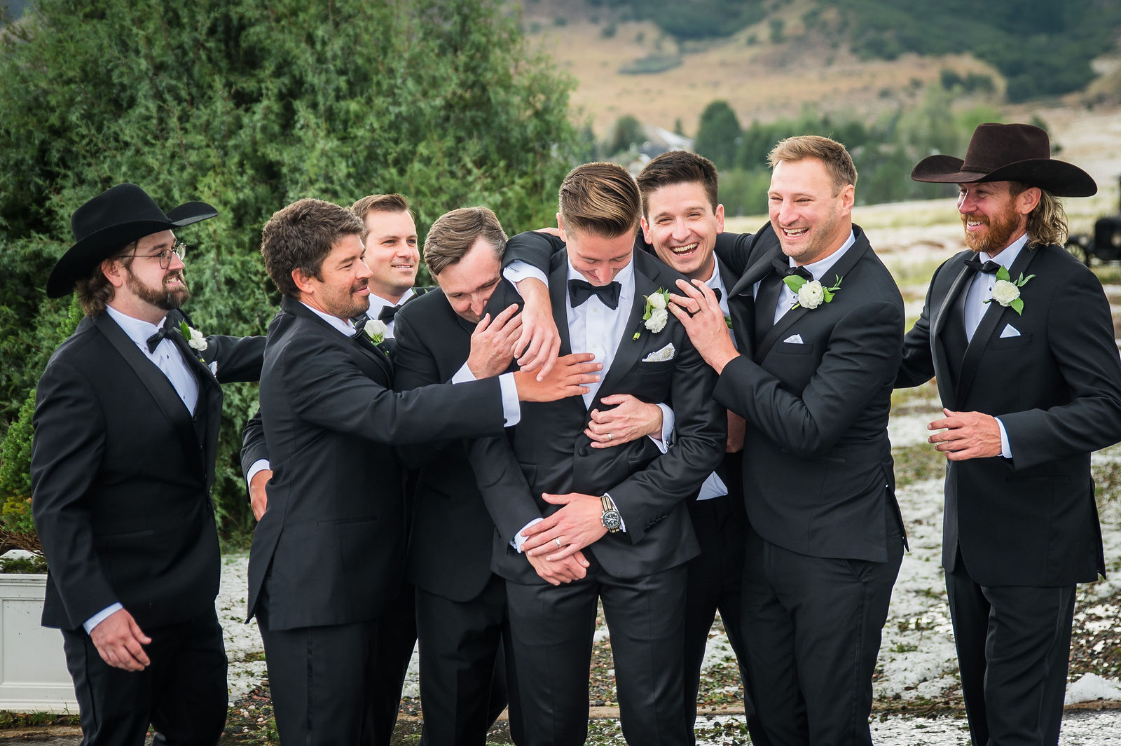 Groomsmen celebrating at a Manor House wedding