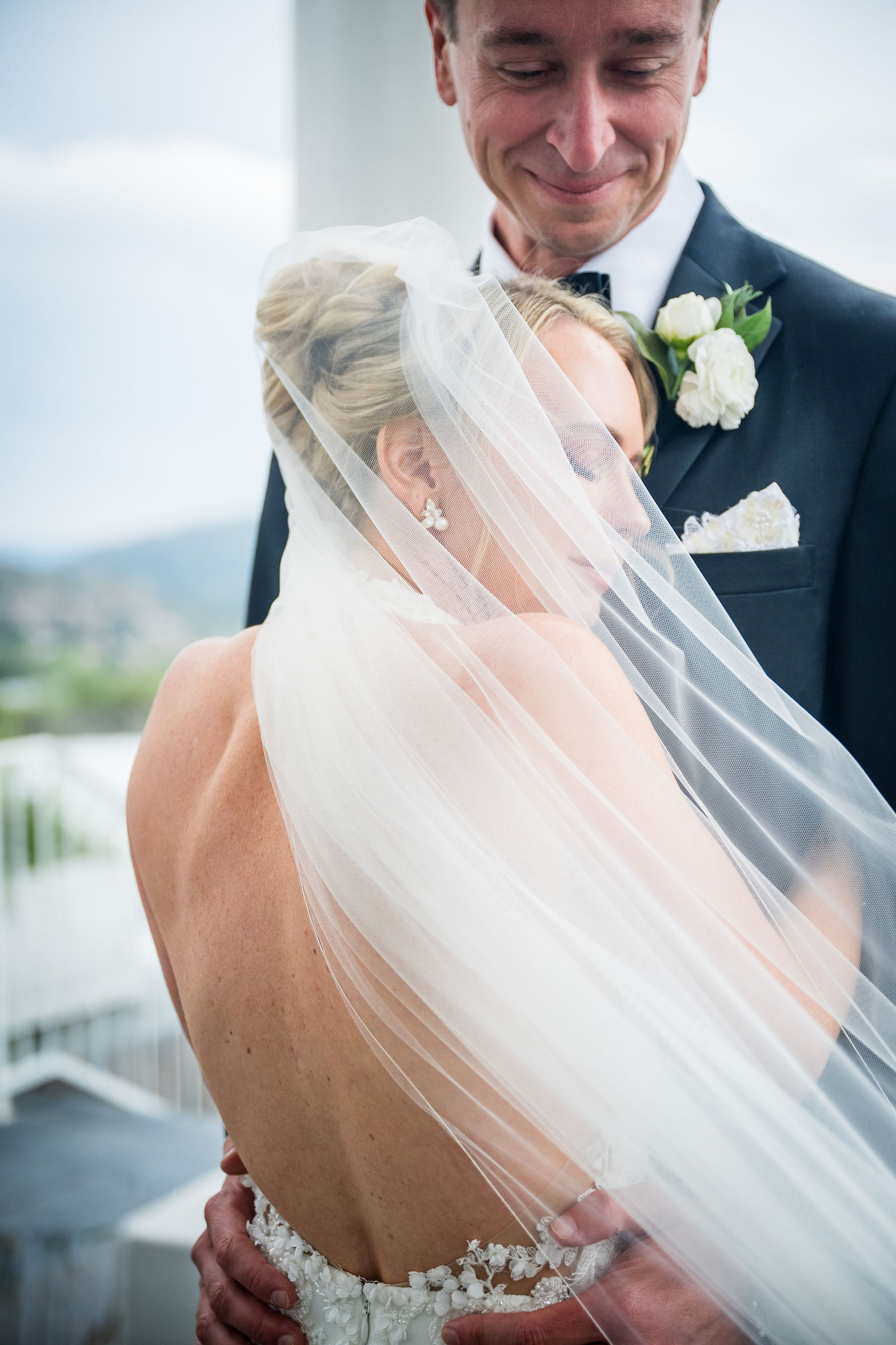 Bride and groom with the veil at The Manor House