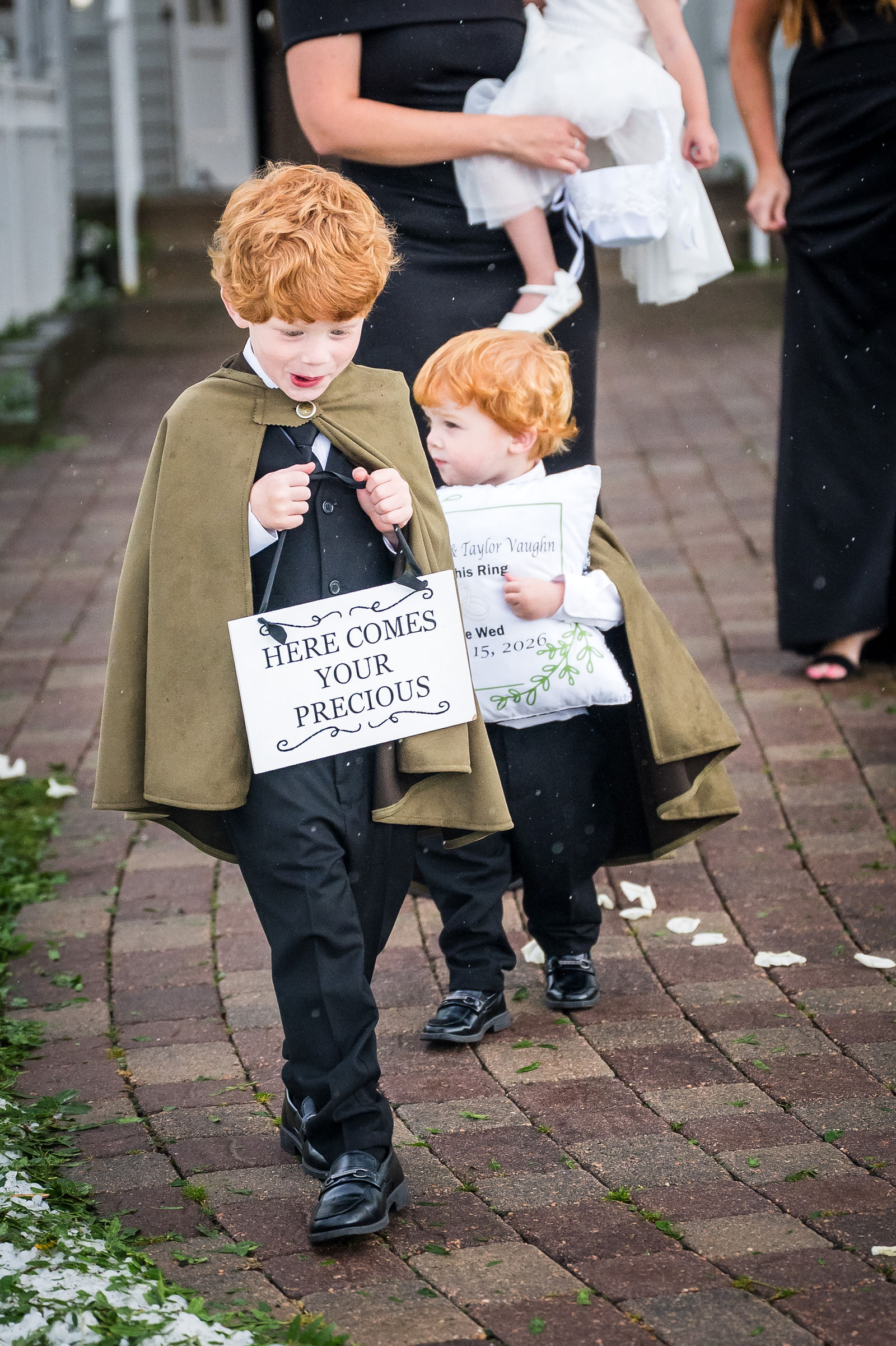 Ring bearers carrying a sign at a Manor House wedding