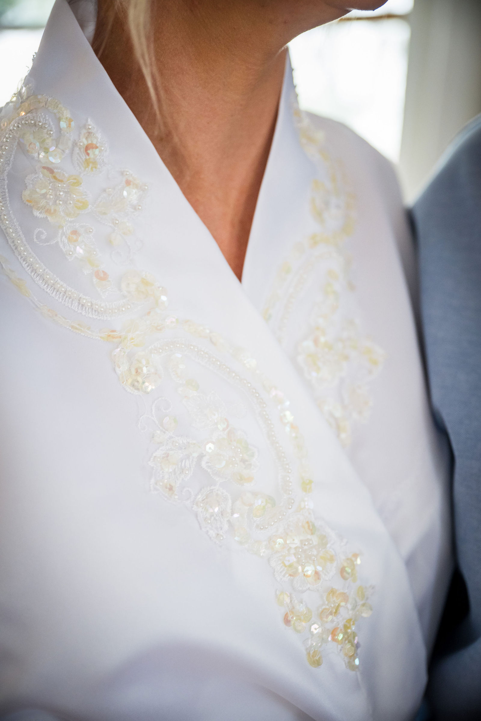 Embroidered detail at a Manor House wedding in Littleton Colorado