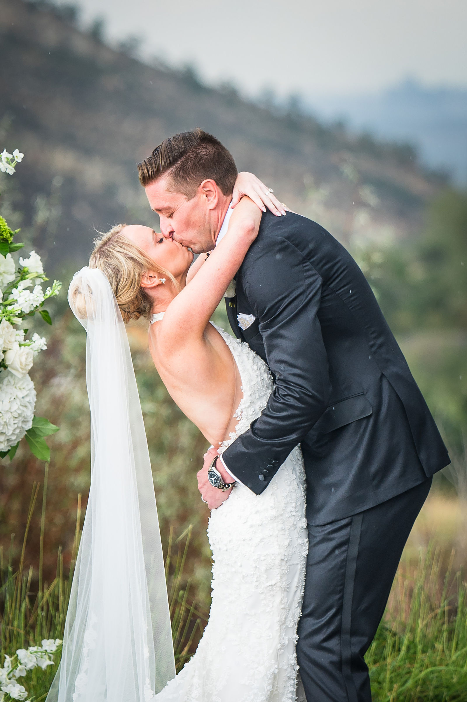 Bride and groom kiss at the end of their ceremony at The Manor House in Littleton, Colorado