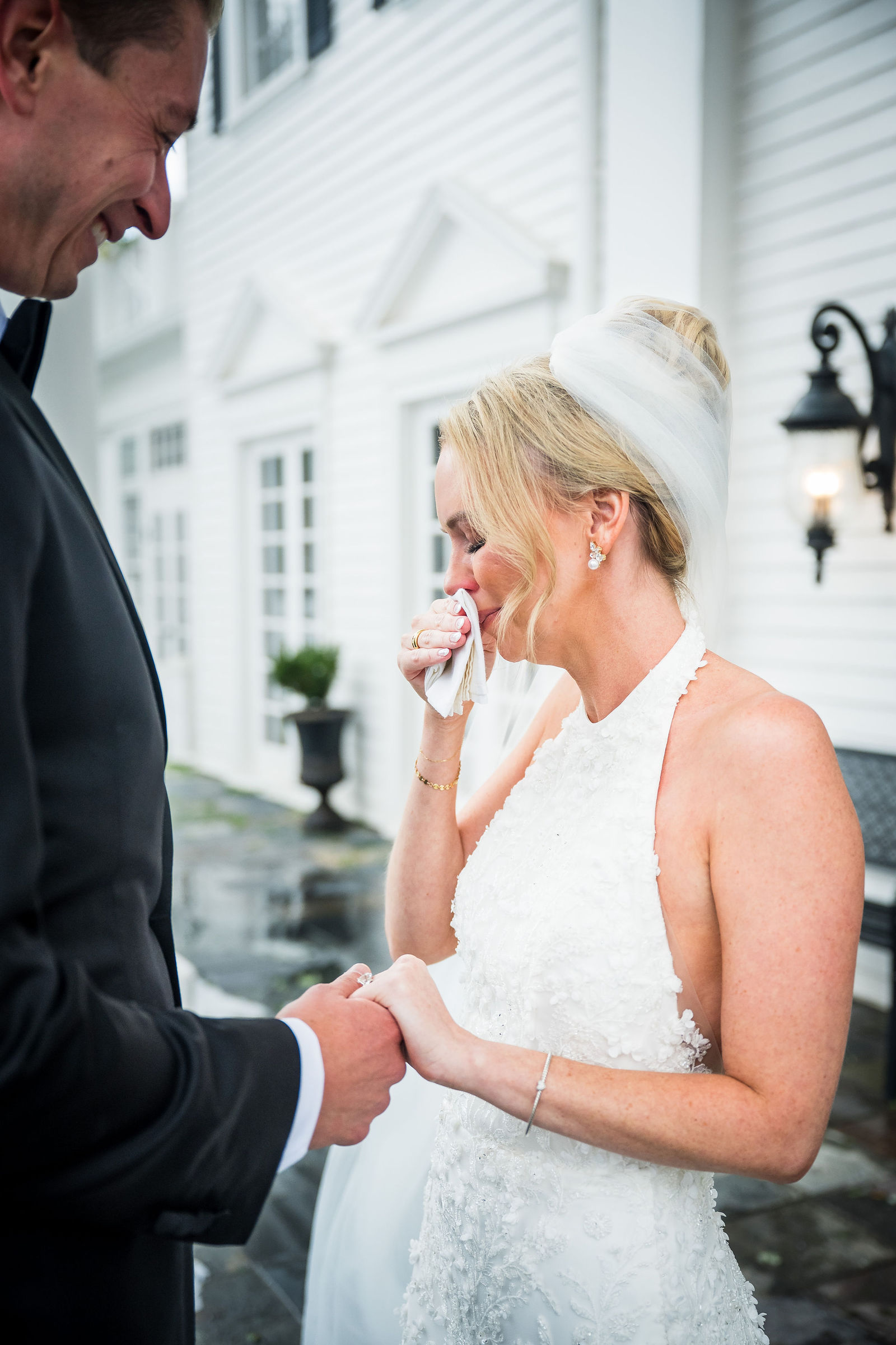 Bride wiping away a tear during private vows at a Colorado wedding