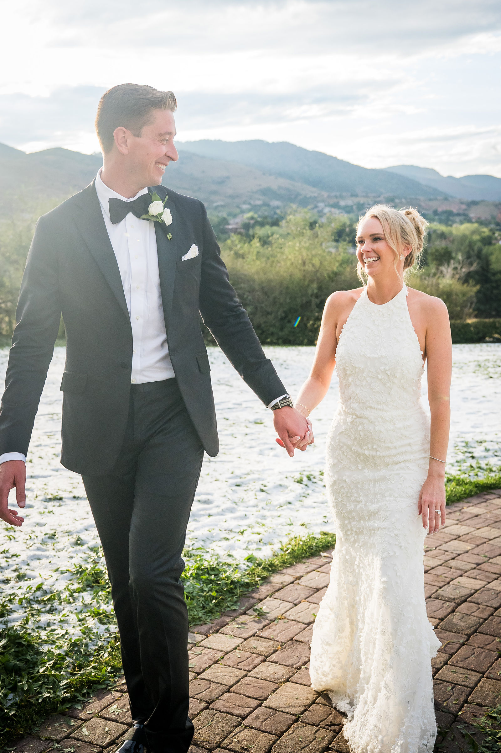 Bride and groom walking at golden hour at The Manor House