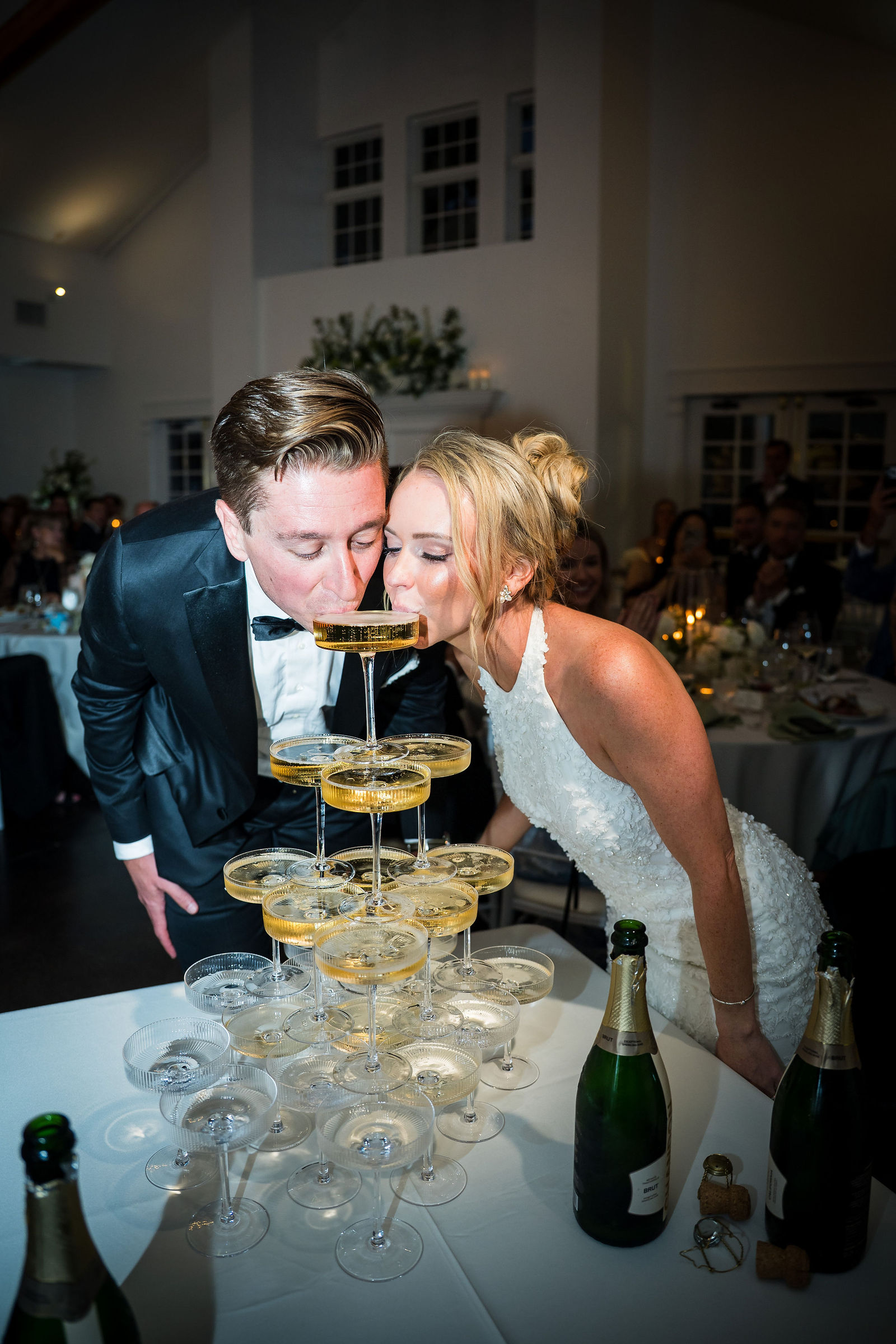 Bride and groom at the champagne tower at The Manor House