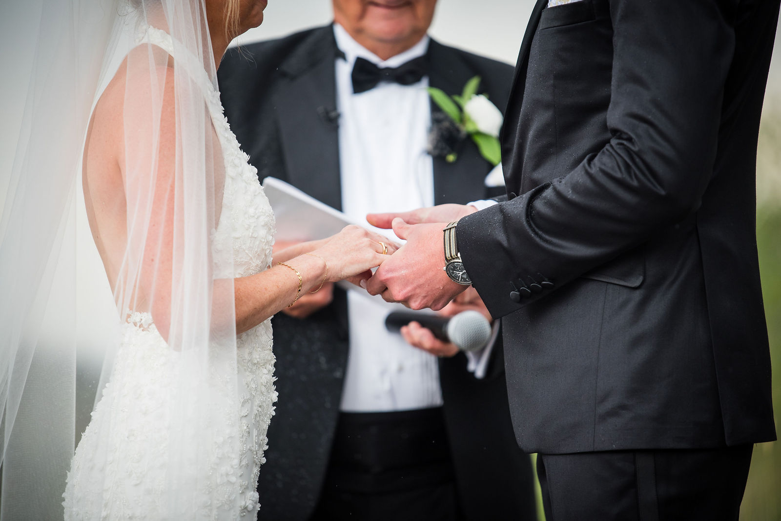 Bride and groom laughing during their vows at a Colorado wedding