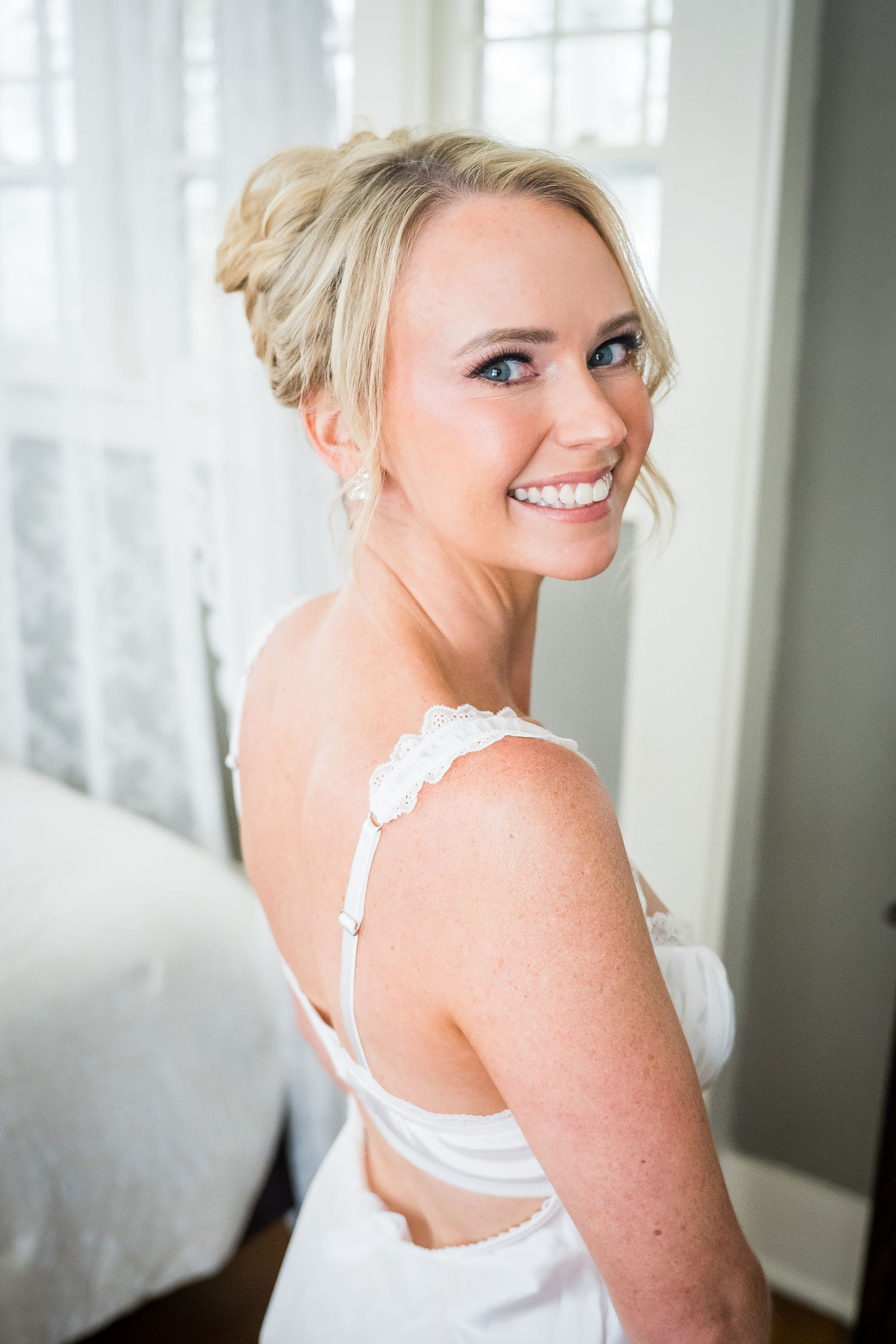 Bride in her wedding dress at The Manor House Littleton Colorado