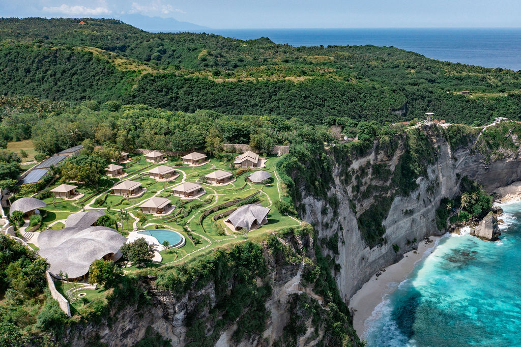 INTAAYA nestled among green hills and ocean cliffs