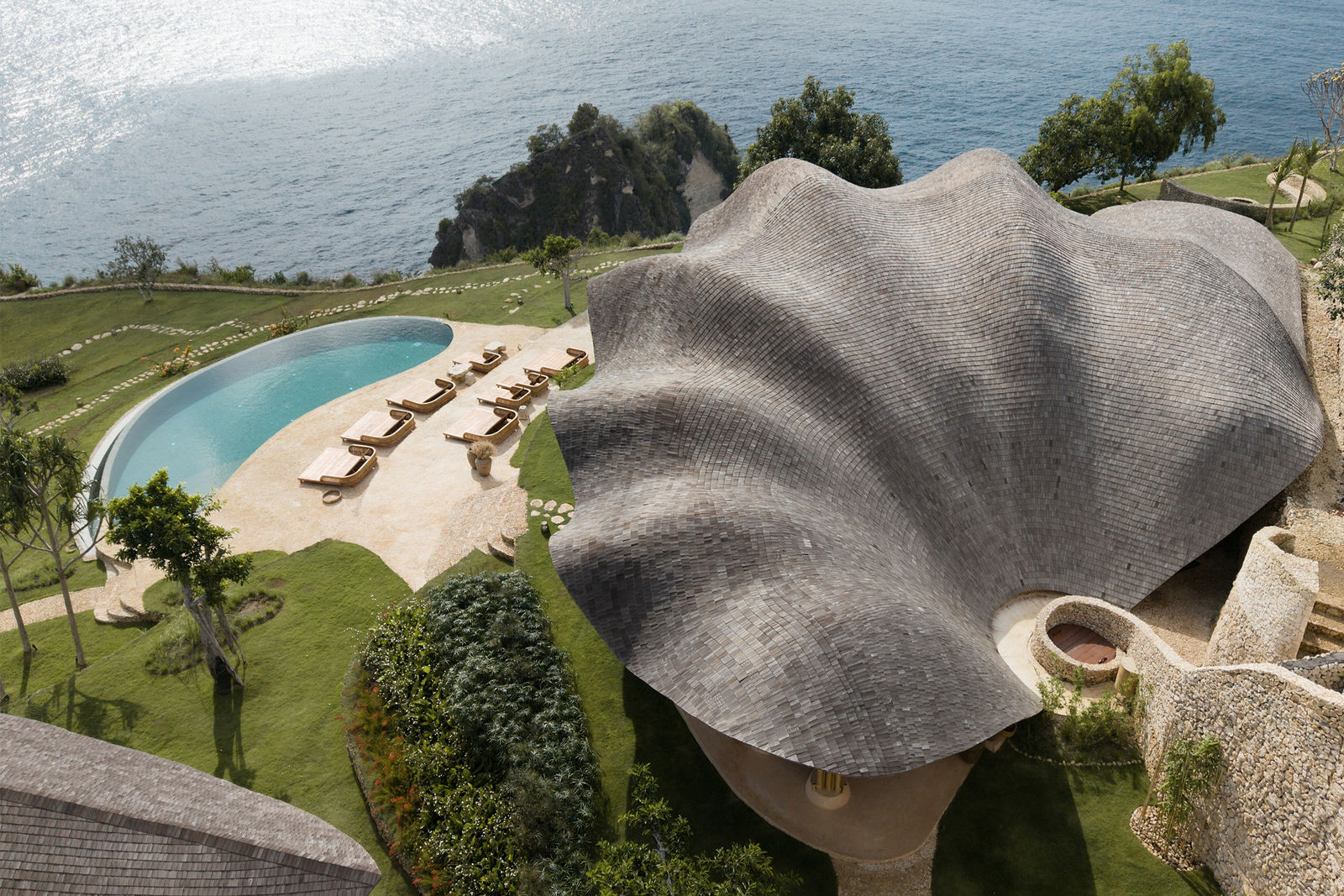 INTAAYA aerial view with pool, organic architecture and ocean
