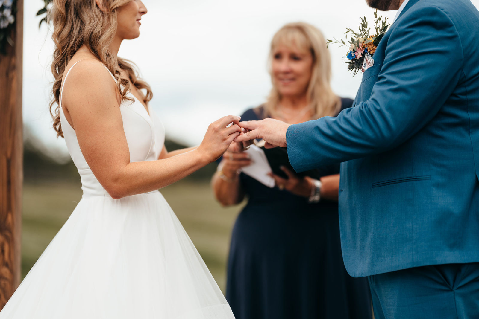 Ring exchange during the outdoor ceremony at Dell-Lea in Chichester NH