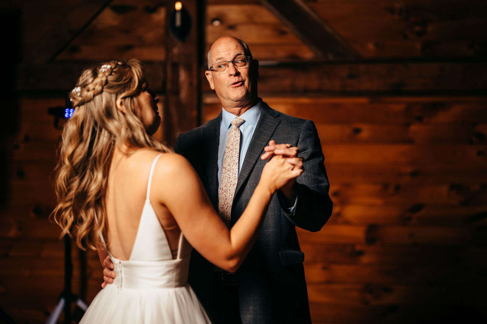 Father-daughter dance inside the barn reception space at Dell-Lea