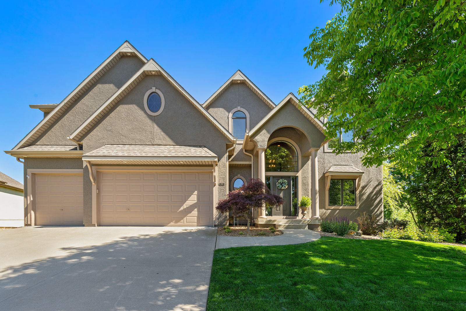 2515 Northeast Lake Breeze Drive by KC Home Photography