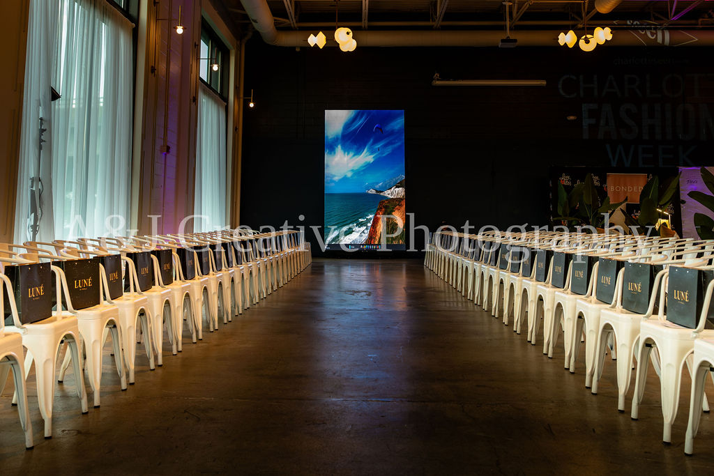 Runway and guest seating prepared for Charlotte Fashion Week