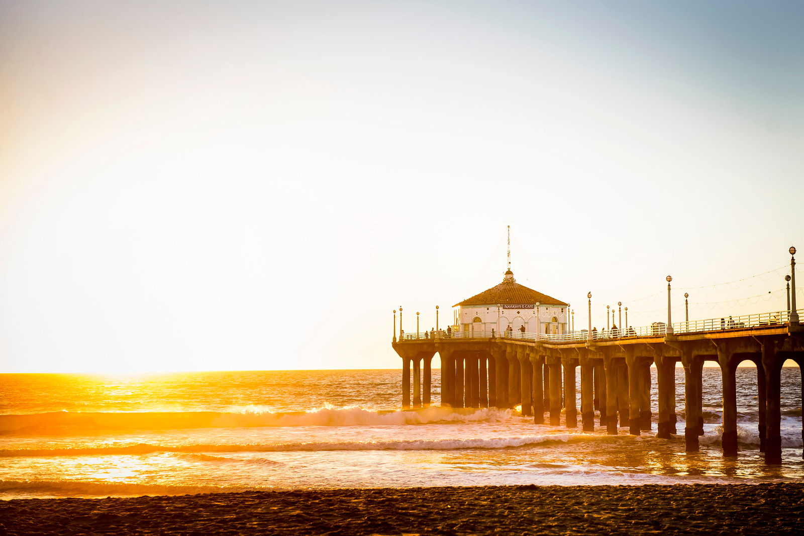 California pier at sunset photographed by Two One Photography