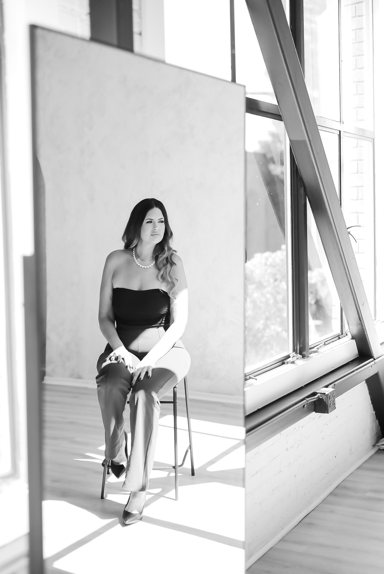 Bay Area brand photography of Taylor Klevins, lead makeup artist and founder of Contour Bridal, in a black top with pearls