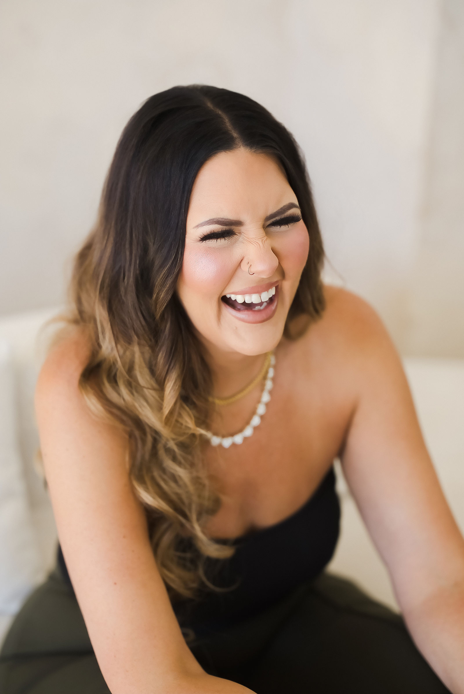 Candid Sonoma County brand photography portrait of Contour Bridal founder Taylor Klevins laughing at The Studio on Fourth in Santa Rosa