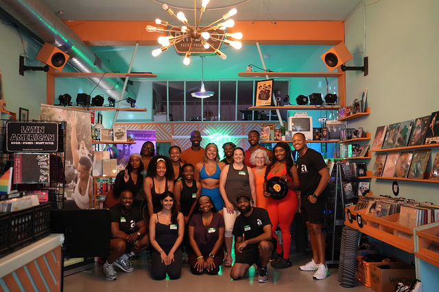 The Corporate Athlete community together at Vinyasa Over Vinyls