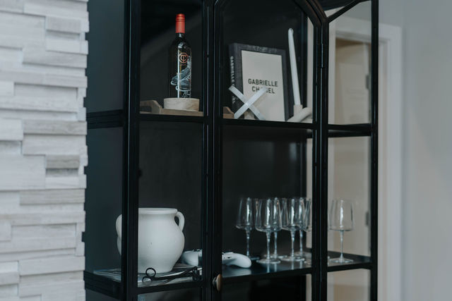 Dark open display shelving and bar details