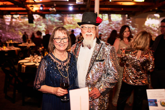 Couple in a sparkling jacket and top hat