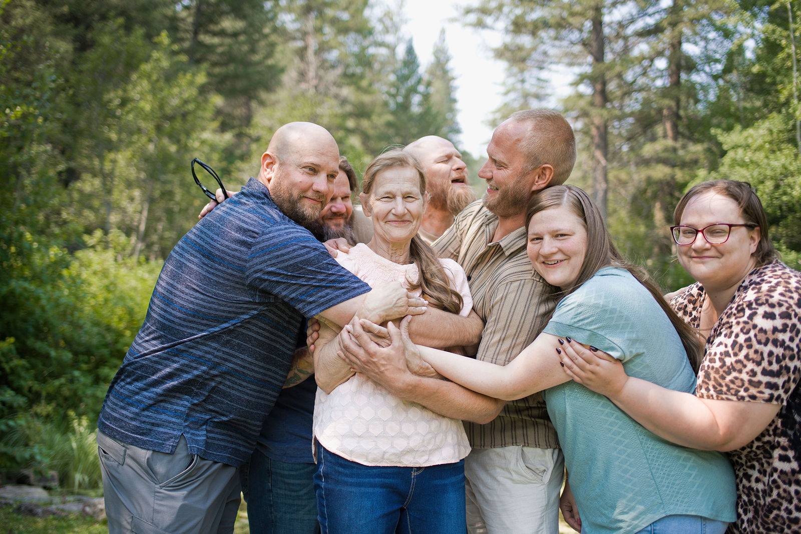 Family gathered in a joyful group hug