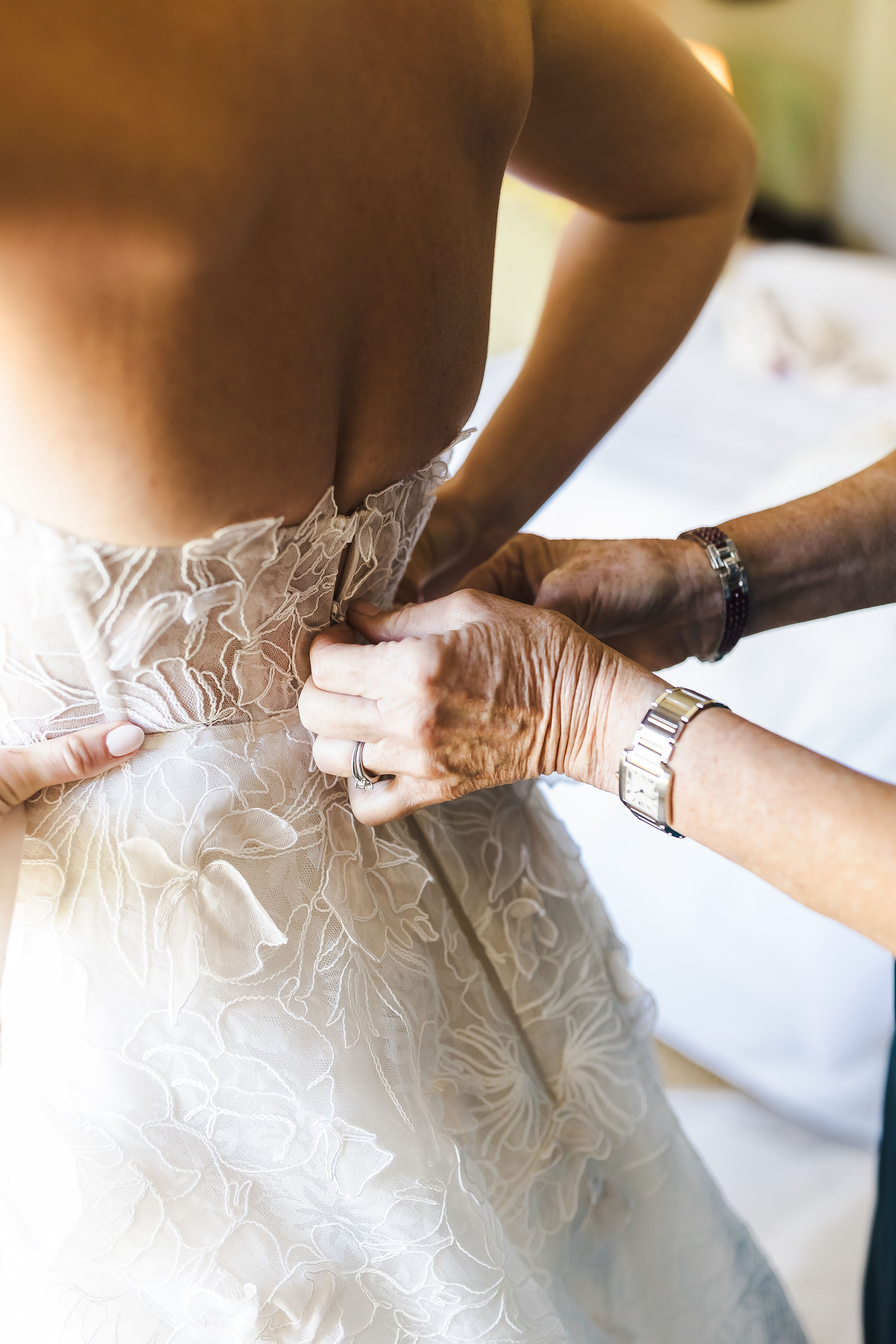 Buttoning the back of the wedding gown, a quiet getting ready moment photographed by a Barndiva wedding photographer