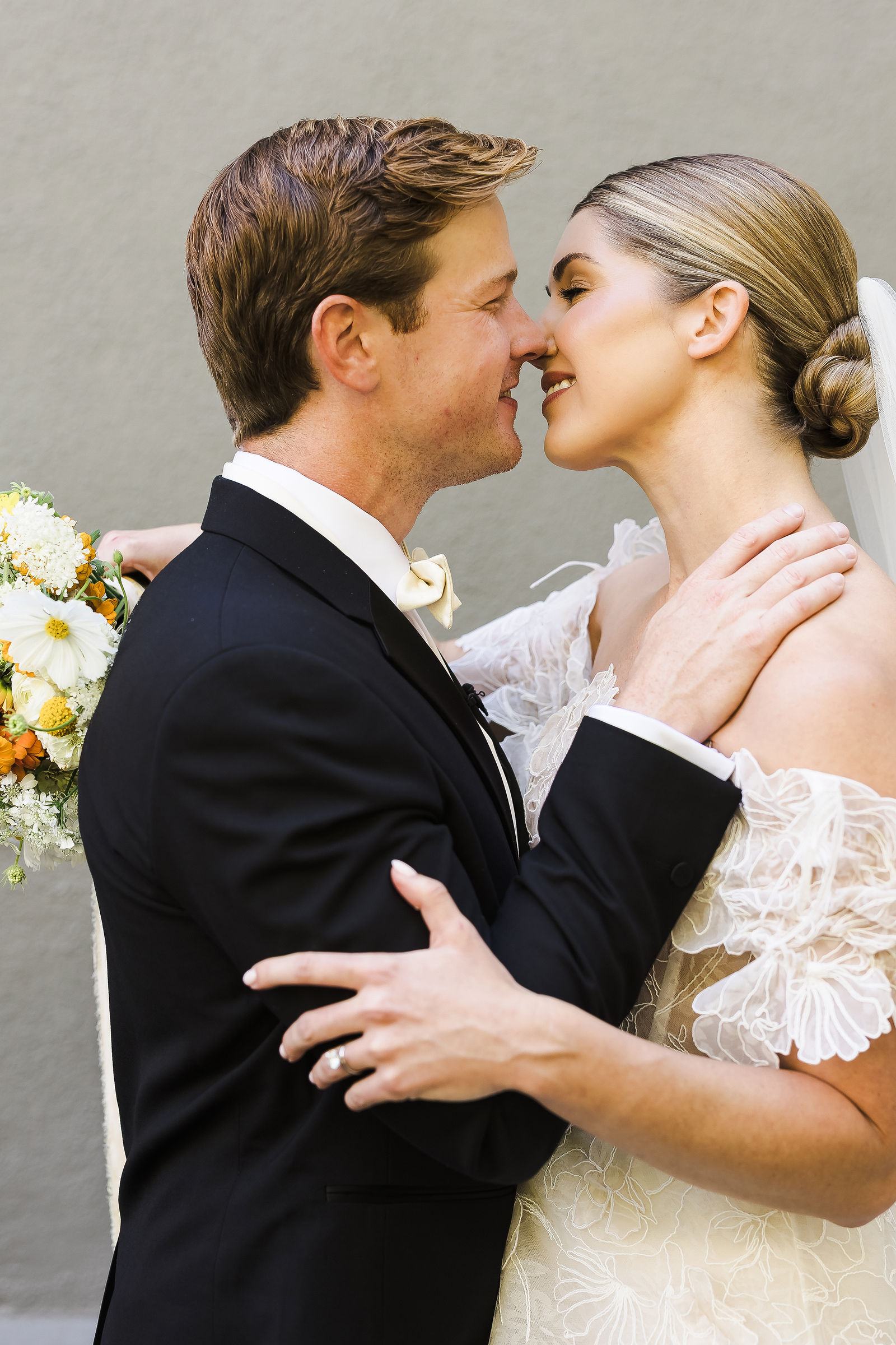 Bride and groom kiss during their first look before a Healdsburg wedding at Barndiva