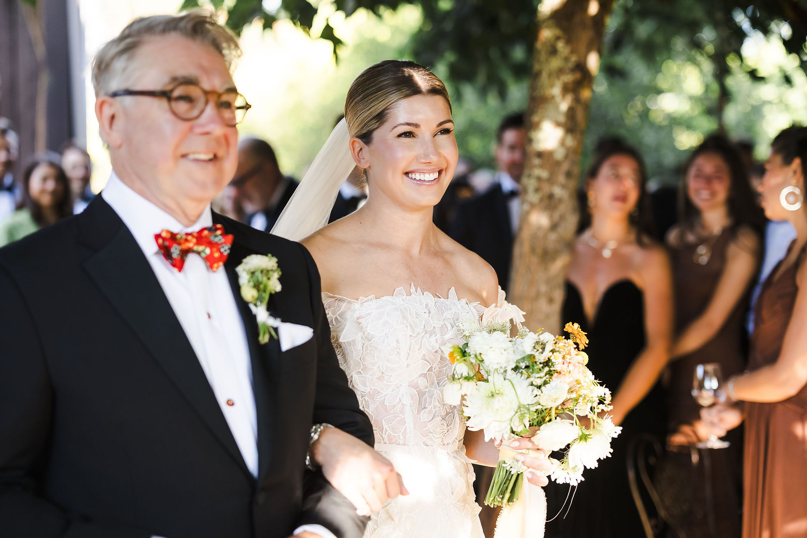 Bride holding her bouquet with family just before her Barndiva garden ceremony in Healdsburg