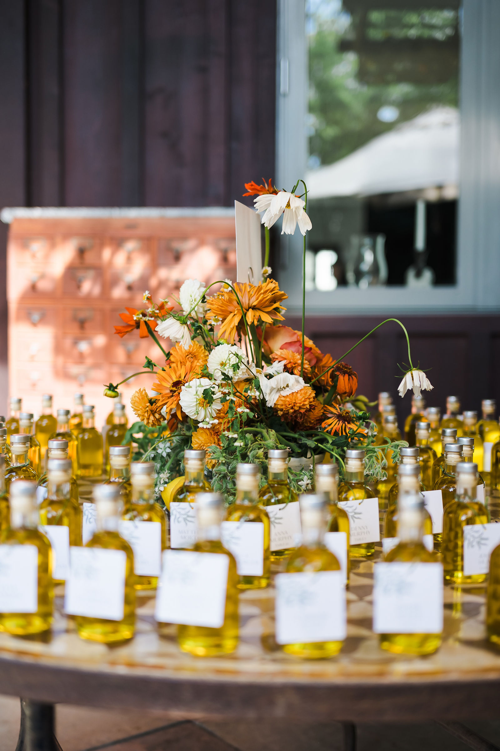 Olive oil bottle wedding favors used as escort cards at a Barndiva wedding in Healdsburg California