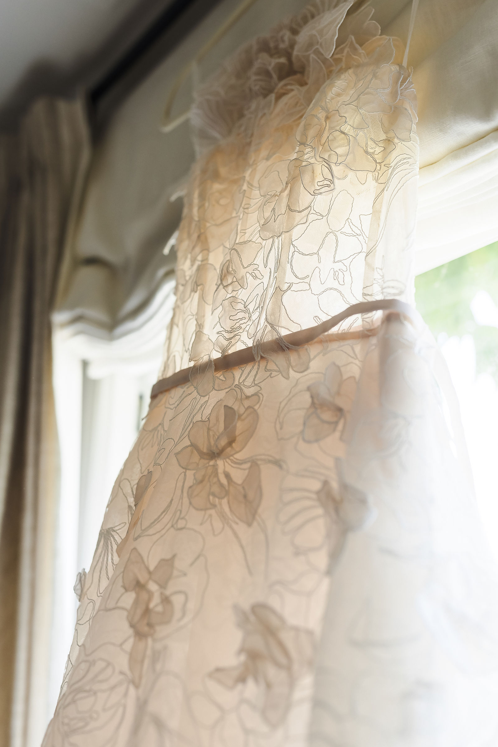 Close up of the lace and floral applique on a Mira Zwillinger wedding gown, Healdsburg wedding photographer detail photo