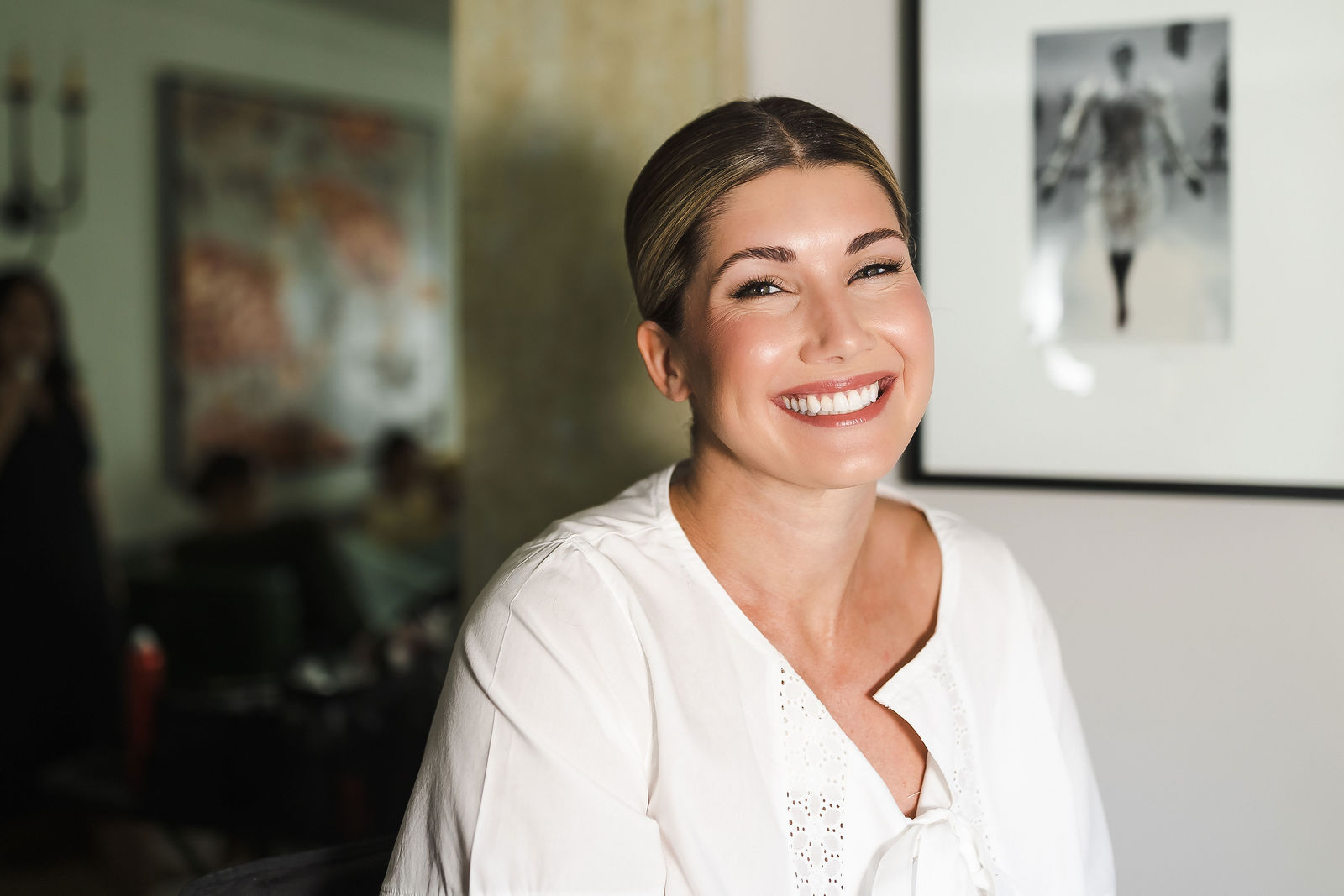 Bride smiling during hair and makeup on the morning of her Healdsburg wedding at Barndiva